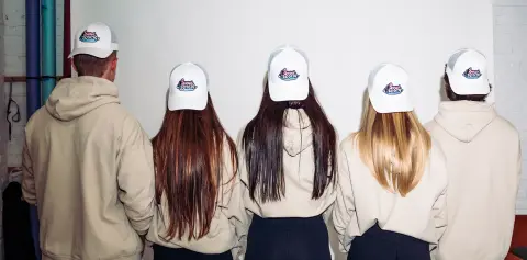 Group wearing Sweat & Soak hats